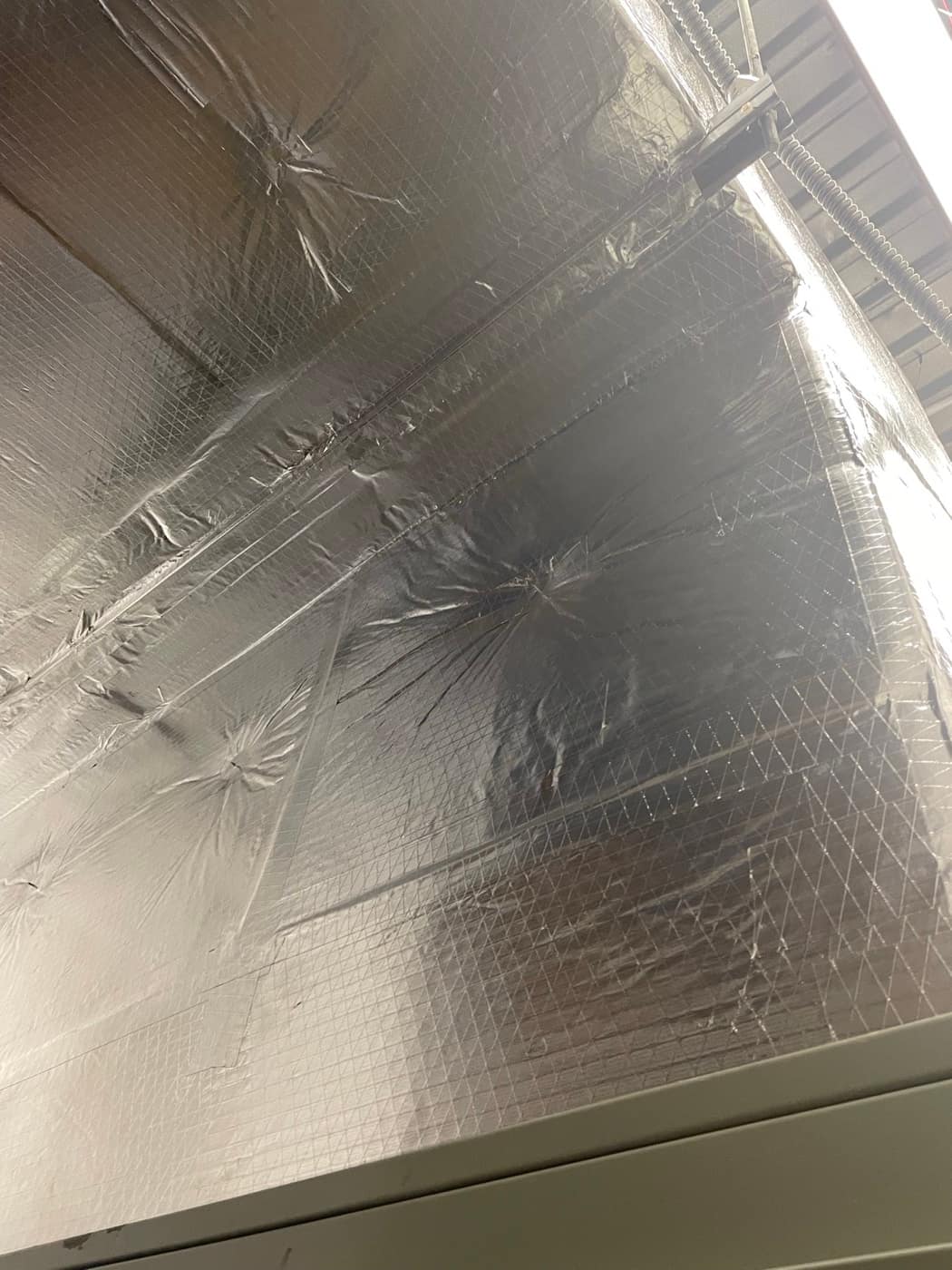 Taped duct wrap seams, close up