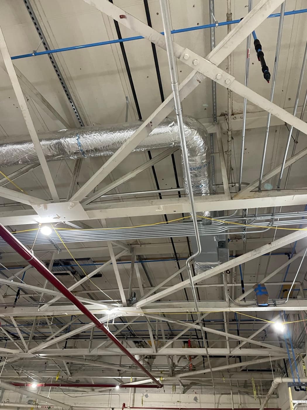 Round duct through joist bays