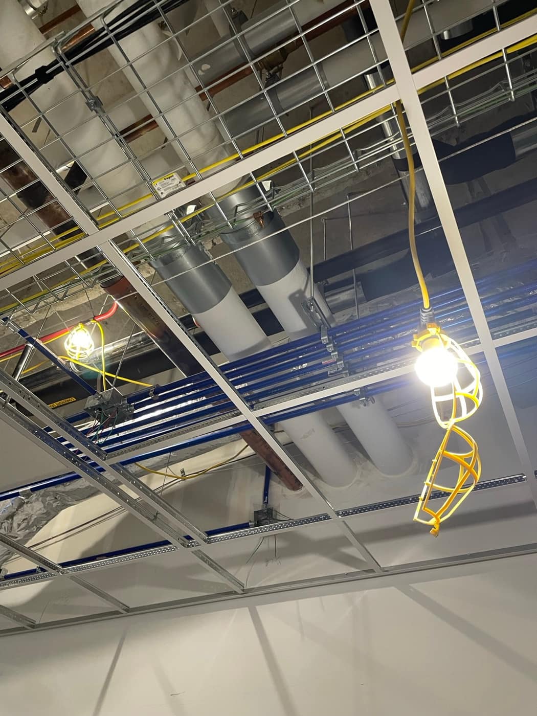 Duct drops above cable tray