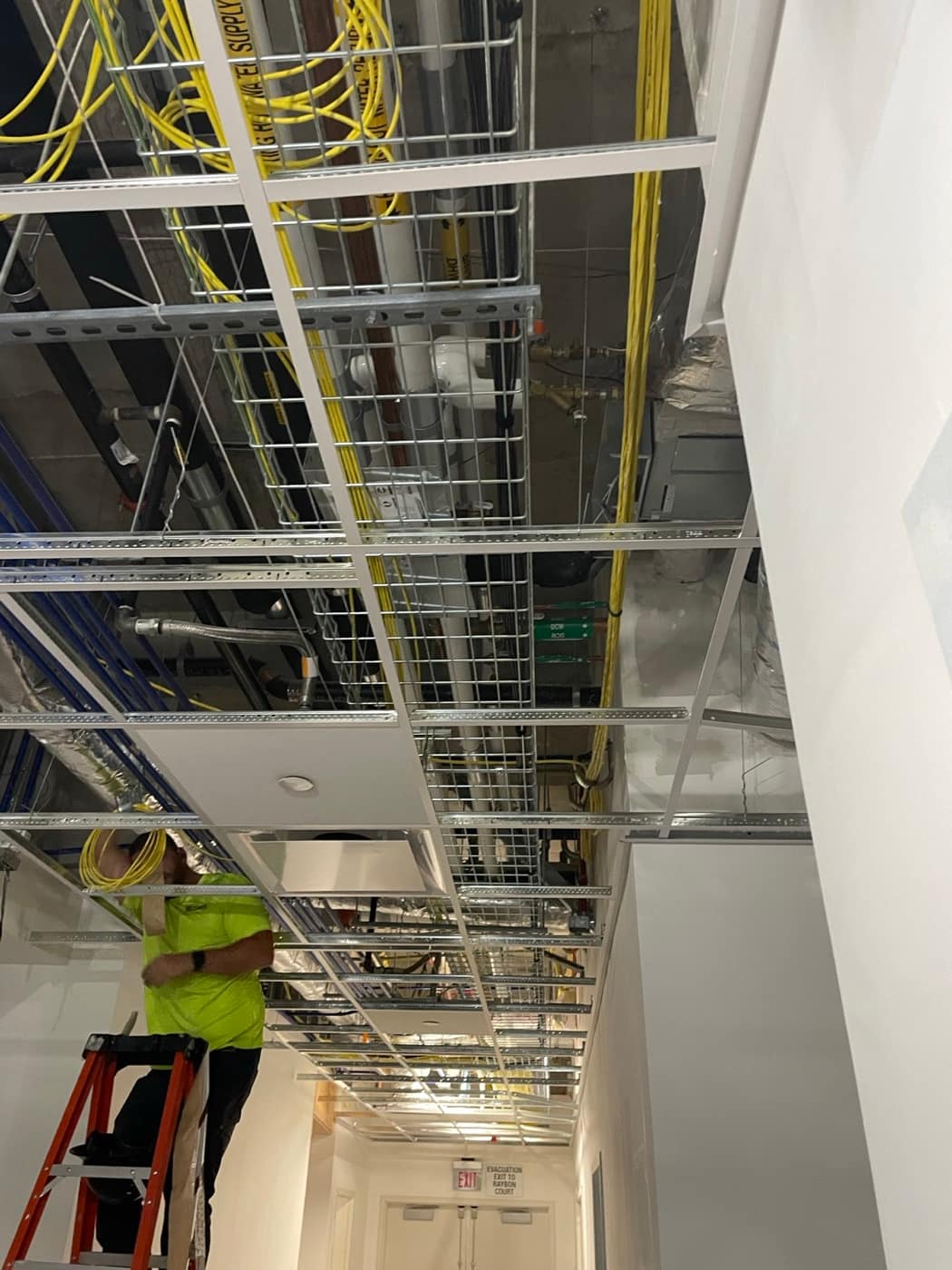 Duct and pipe in corridor plenum