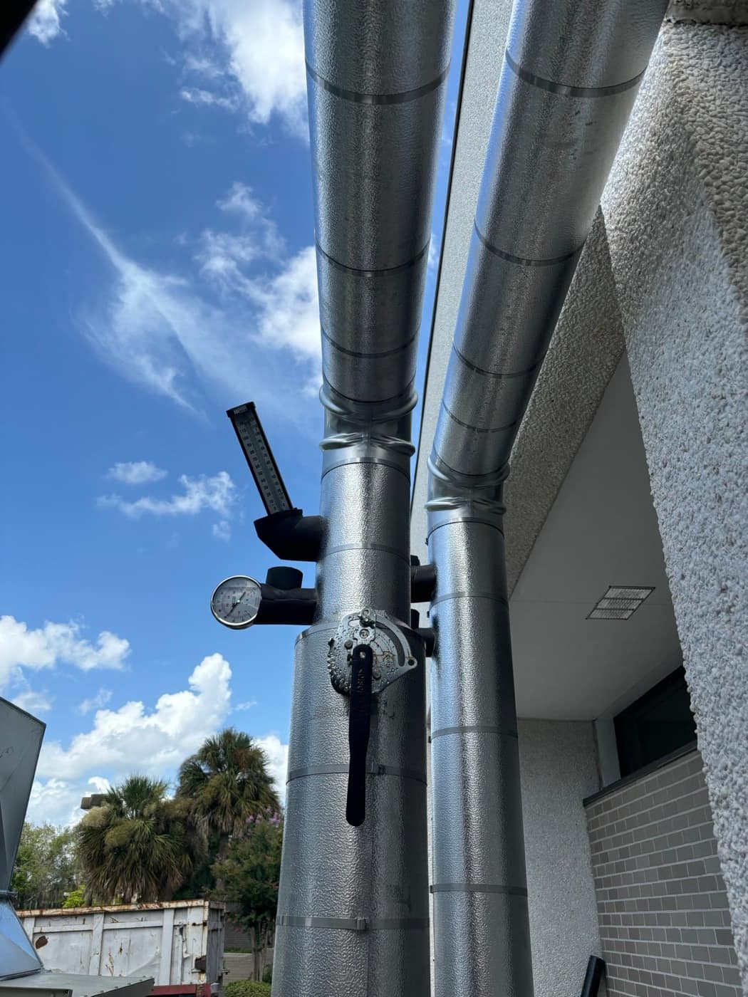 Metal jacketed risers with test ports