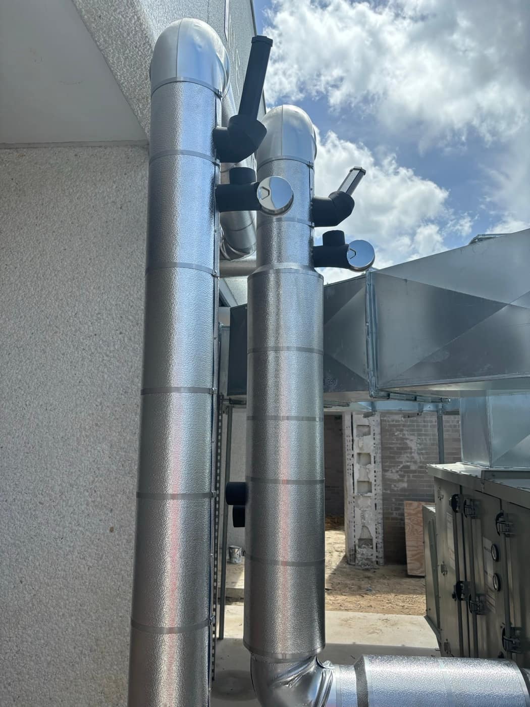 Jacketed risers, elastomeric valves